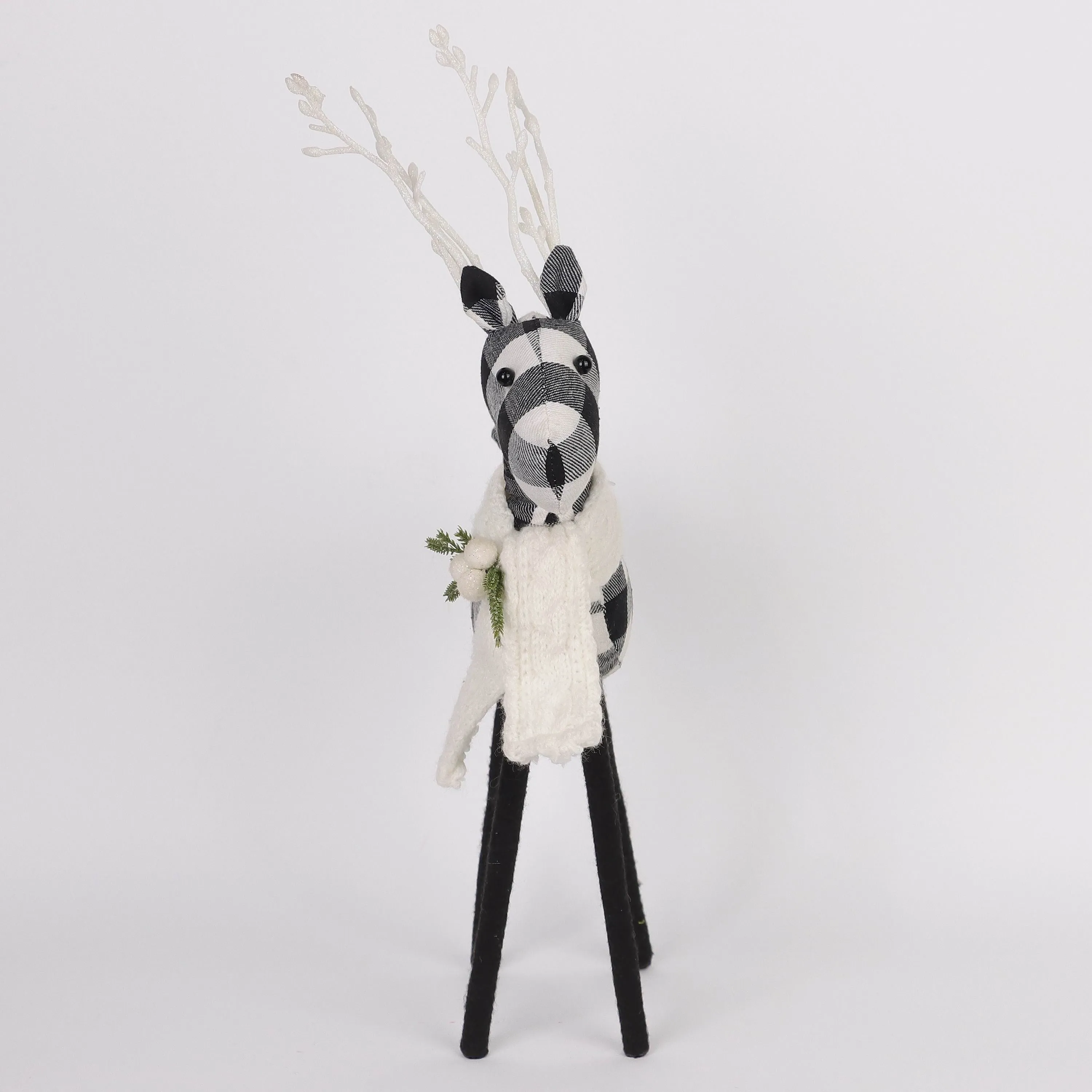 Black and white checkered 
reindeer with knitted scarf